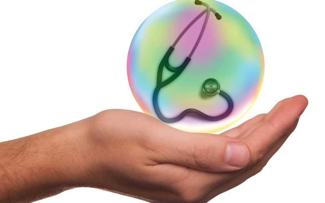 pet health insurance - stethoscope inside an imaginary ball, suspended above a cupped palm